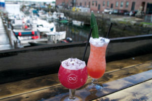Enjoy one of Liquid Riot's signature cocktails on the back deck.