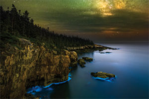 Glowing Coast Big thanks to Benjamin M. Williamson Photography for the heads up on the bioluminescence along the cliffs of Acadia National Park in Maine! After spending the weekend at the end of the coast of Maine, I finished out the trip by stopping by Acadia on Monday to see the sight with my own eyes. It was absolutely incredible! While the glow in the photo is brighter and much more blue than it was in person due to the limitations of human vision, and the fact that that camera can see more with long exposures, it was still intense to see in person and the photo doesn’t do the experience justice. The blue light is real, and is just about how my camera captured it, I didn’t do anything to boost the blue. My night vision was adapted enough to see the bright glow in the water as the waves washed over rocks, exciting the microorganisms in the water. For more detailed information on bioluminescence please check out Ben’s Facebook page and his photo from the same spot, he has a comment that explains bioluminescence emitted from dinoflagellates. This is a blend of 10 exposures for the sky and 2 foreground exposures. 10 shots for the sky were each taken at ISO 10,000, 10 seconds, f/2.8, and then stacked with Starry Landscape Stacker for pinpoint stars and low noise. The 2 foreground exposures were taken at lower ISO and longer shutter speeds for a cleaner foreground, 1 at ISO 1600 for 20 minutes and another at ISO 6400 for 2 minutes, both at f/2.8. The exposures were then blended in Photoshop to create a single image with low noise and sharp focus. All shots were taken with the Nikon D810A and Nikon 14-24mm f/2.8 lens at 14mm. To learn more about my Milky Way photography editing techniques check out my written tutorials and videos on my website, click the Shop Now button at the top of my Facebook page to go to my website. #Maine #Acadia #bioluminescence #MilkyWay #photography #LandscapeAstrophotography #night #stars #AdamWoodworthPhotography